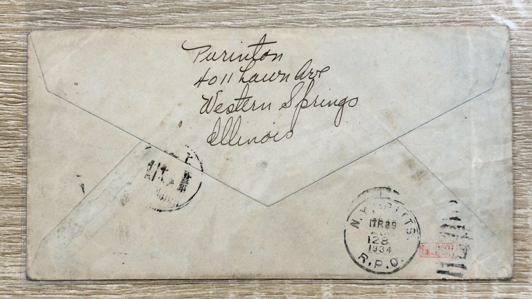 Reverse of the cover showing handwritten return address and postal markings